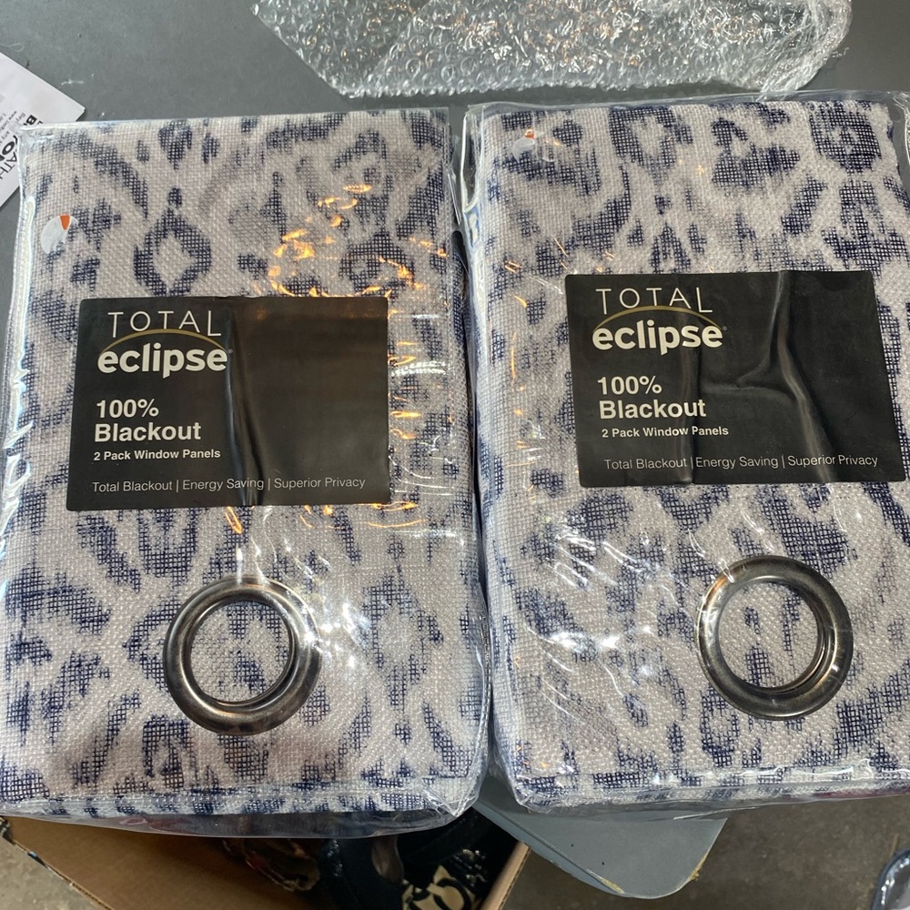 Blue and white patterned blackout curtains